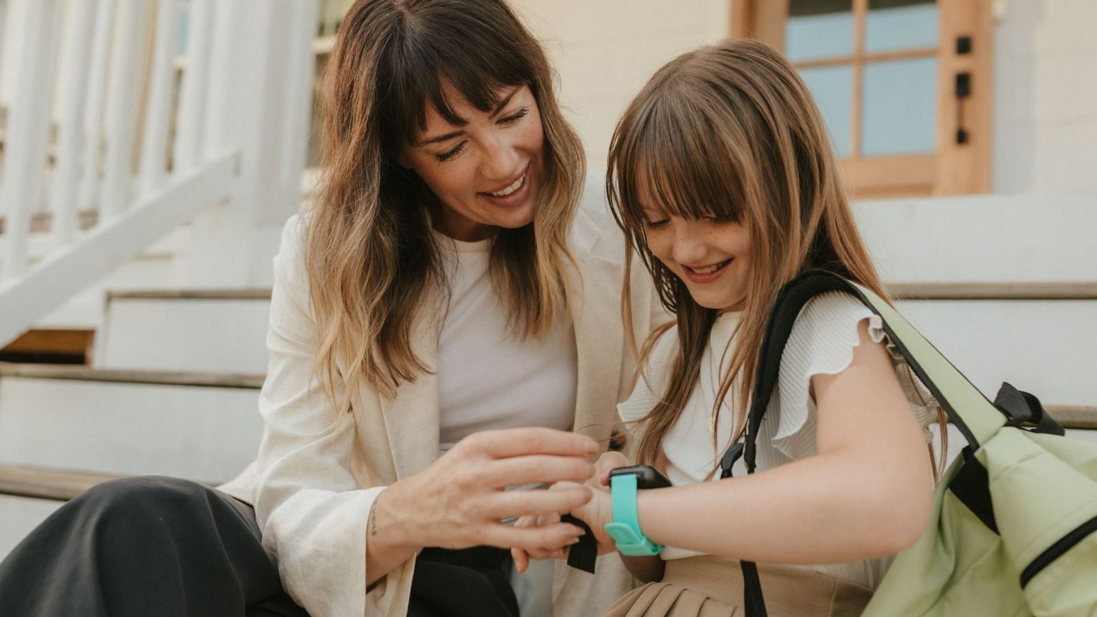 Mom and daughter looking at a Cosmo watch together